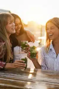 Three-women-outside-drinking-mojitos