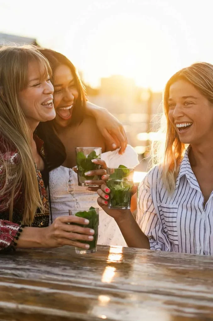 Three-women-outside-drinking-mojitos
