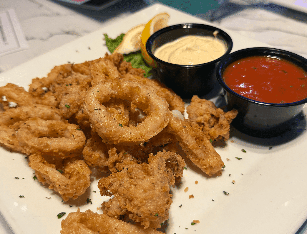 Fried calamari and onion rings served with marinara and aioli at Fish Tale Grill Cape Coral.