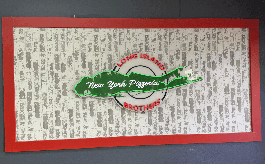 Long Island Brother’s Pizza sign displayed on the restaurant wall in Cape Coral, Florida