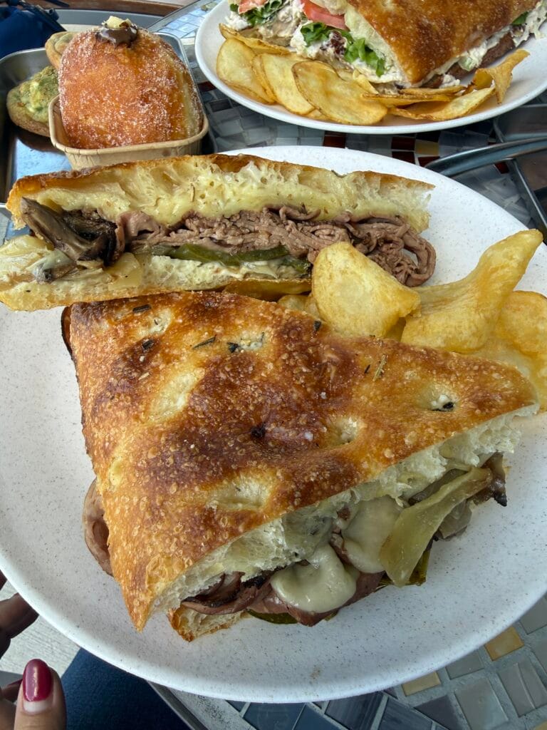 Hot Italian sandwich with melted cheese on focaccia at Amore Italian Market And Bakery.