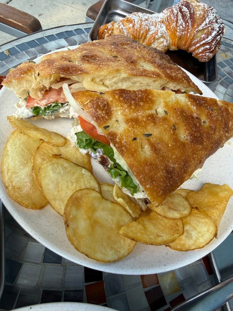 Italian deli sandwich on gluten-free focaccia with chips from Amore Italian Market And Bakery.