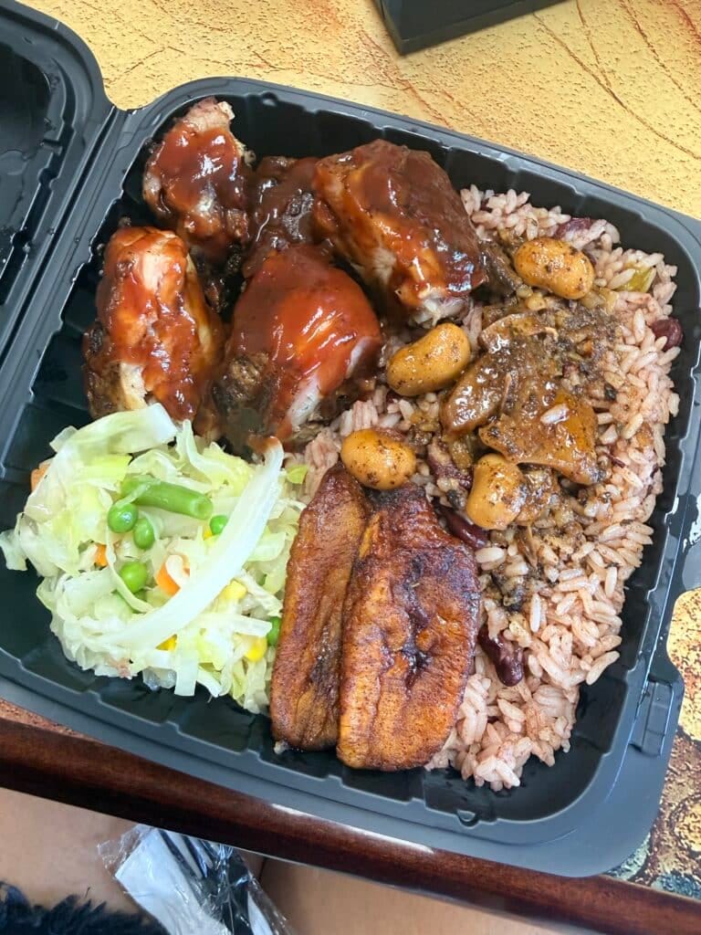 Jerk chicken plate with rice and peas, cabbage, and fried plantains from Manda’s Jerk Chicken in Cape Coral